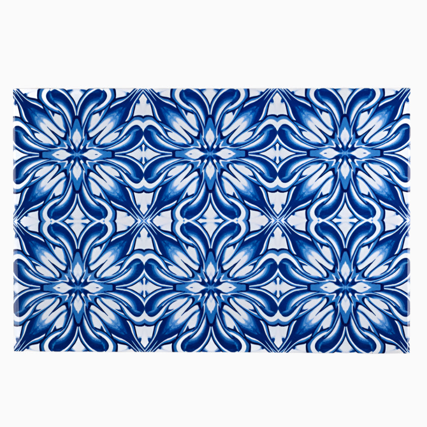 Rectangular tile with blue floral pattern on a white background