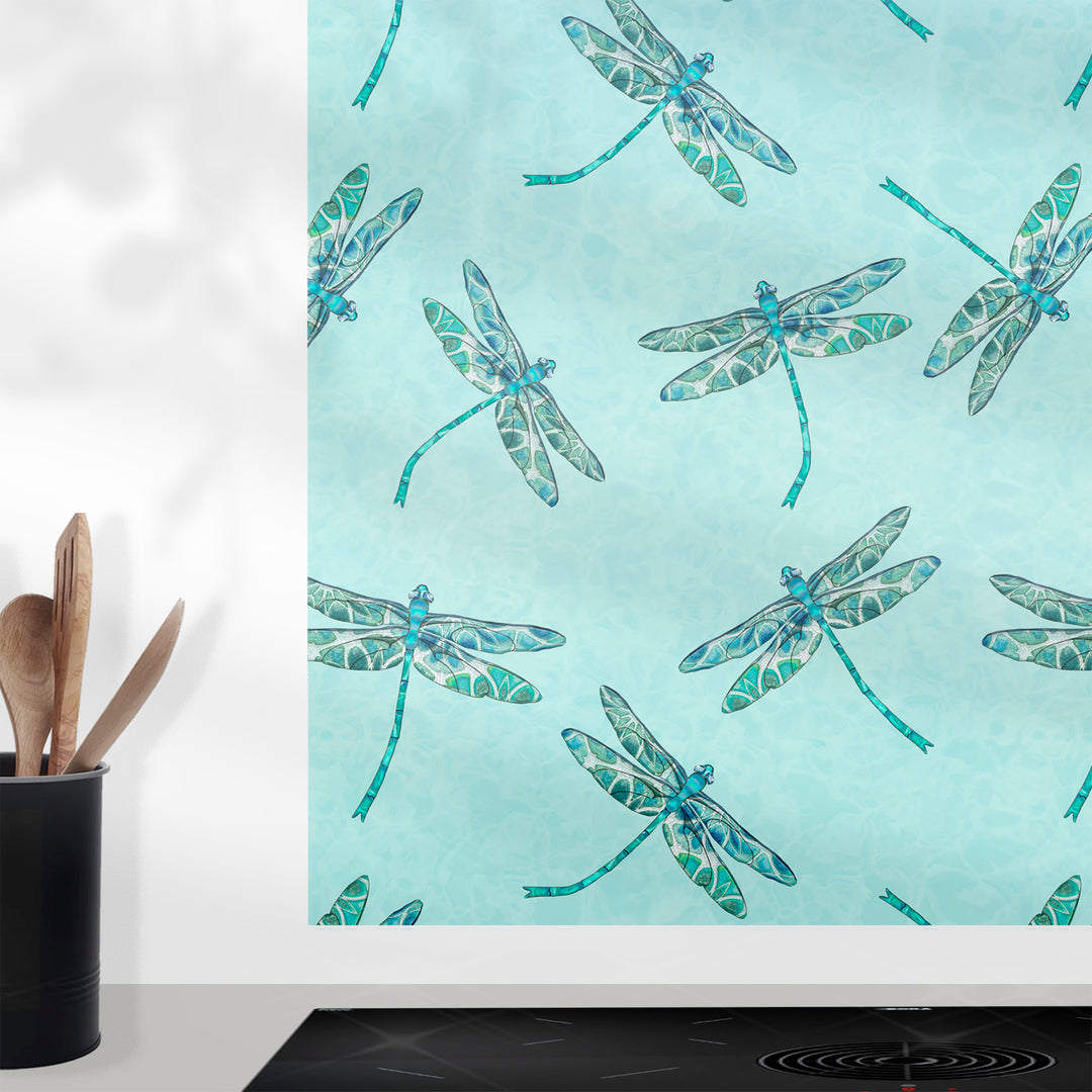 Glass splashback  with dragonfly pattern on a light blue background, shown in a kitchen setting.