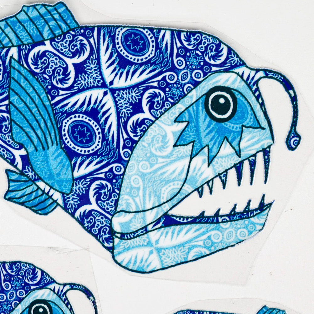 Three stylized blue fish illustrations with intricate patterns on a white background