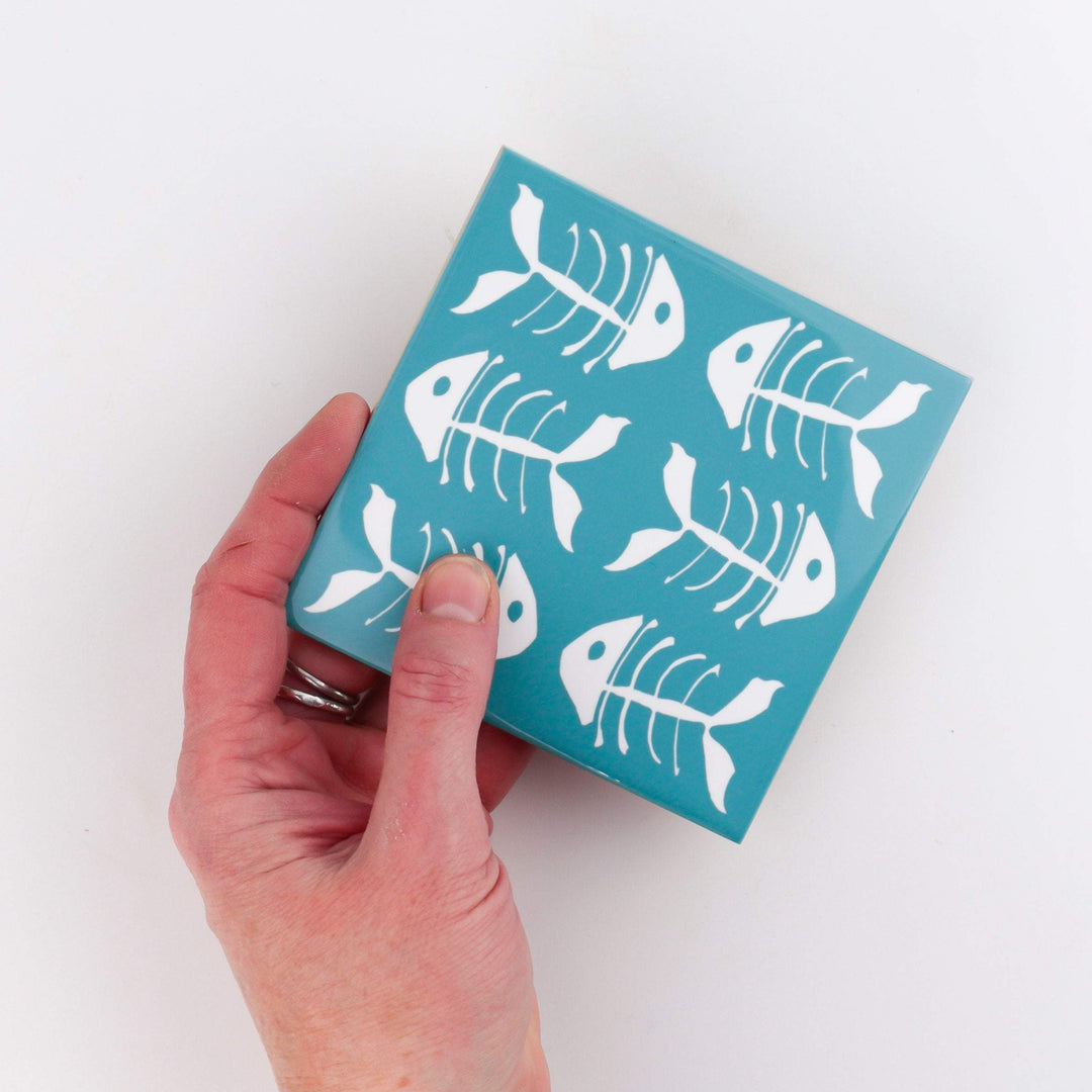 Rich blue kitchen tiles, funky bone fish design