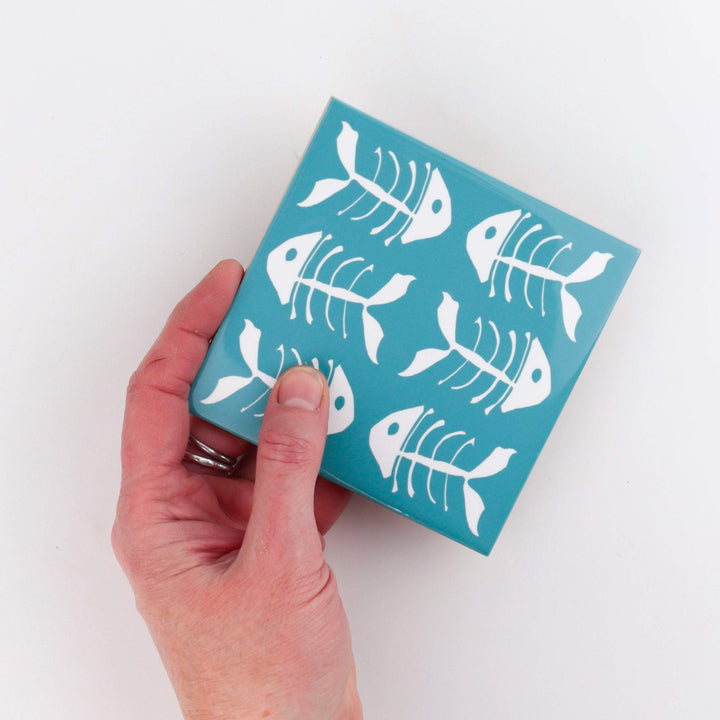 Rich blue kitchen tiles, funky bone fish design