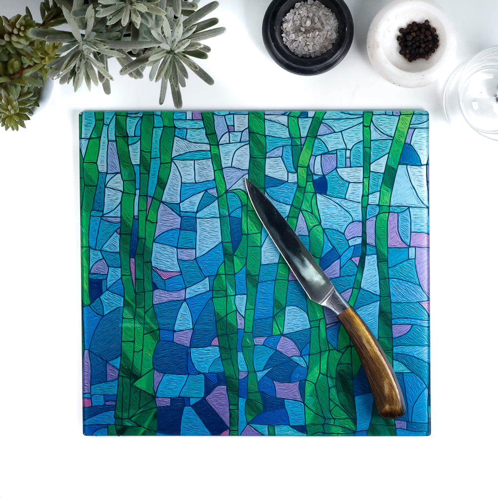 Colorful cutting board with a knife on a white surface