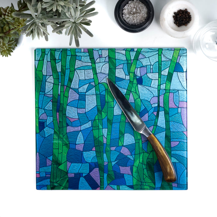 Colorful cutting board with a knife on a white surface