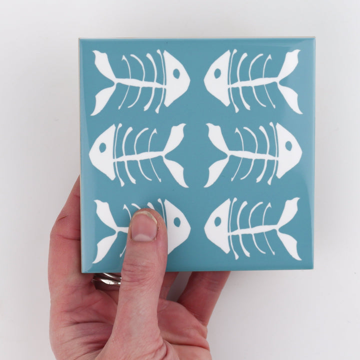 Rich blue kitchen tiles, funky bone fish design
